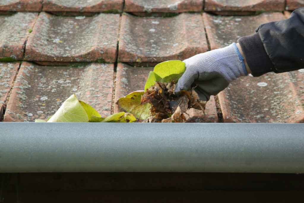 hand cleaning gutter